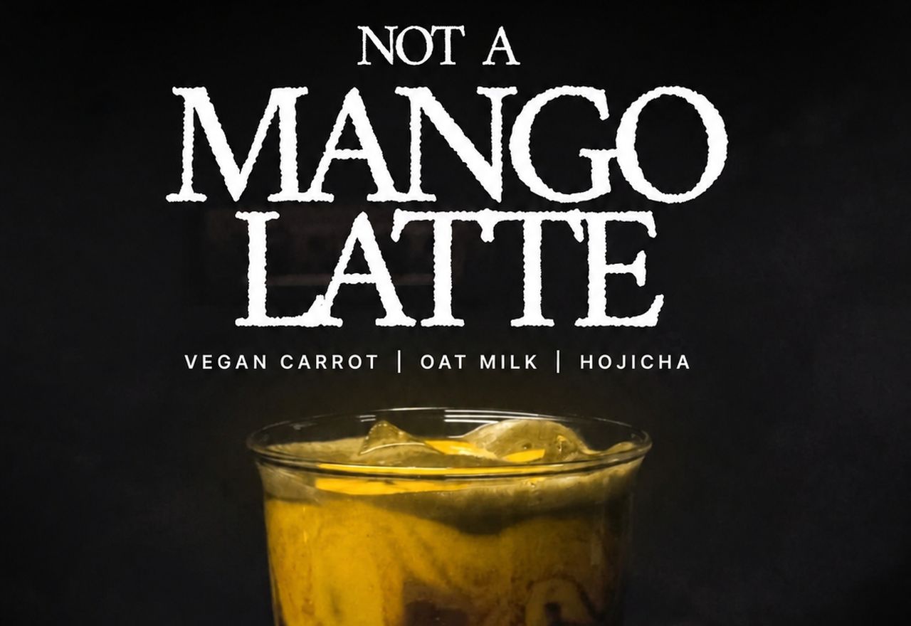 Instagram post for a specialty coffee brand: oversized display type reading &lsquo;Not A Mango Latte&rsquo; above a moody photograph of a layered iced carrot and hojicha drink.
